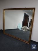 A very large gilt framed overmantel mirror