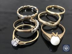 An 18ct gold band ring (1.6g), together with a 9ct gold pearl set ring (2.