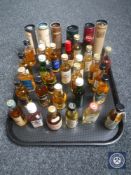 A tray of approximately 35 whisky miniatures