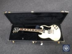 A cream Gibson SG electric guitar in hard black case CONDITION REPORT: Fine crack