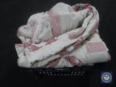 A box containing three bed throws