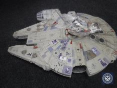 A late twentieth century Star Wars Millennium Falcon together with a bag containing nine Star Wars