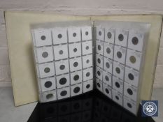 A leather album containing 20th and 21st century foreign coins