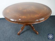An Italianate pedestal dining table