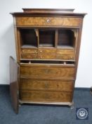 A nineteenth century continental mahogany secretaire chest on paw feet CONDITION REPORT: