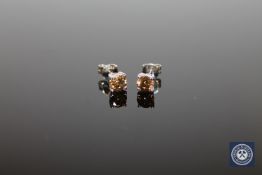 A pair of 14ct white gold diamond stud earrings,