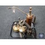 A tray of two antique copper and brass pump pots, oil lamp,