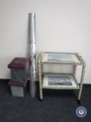 A twentieth century wicker two tier trolley together with a chrome fire curb