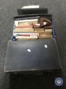 A vintage case together with a basket containing antique books, maps, card games,