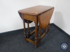 An early twentieth century oak gateleg table
