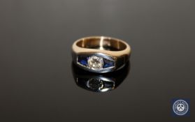 An 18ct gold sapphire and diamond ring, the central diamond weighing an estimated 0.