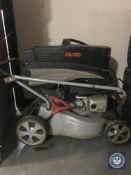 An Alko petrol lawn mower with box