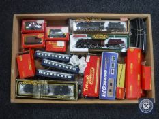 A box of assorted railway rolling stock and track including Mainline 00 gauge engine and wagons,