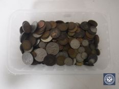 A tub containing pre-decimal British coinage,