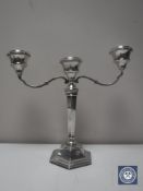 A silver three-way candelabrum