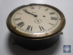 An early 20th century circular brass cased clock