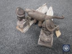 A cast iron Beatle boot jack together with a pair of cast iron figural fire dogs
