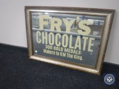 A gilt and silvered framed mirror bearing Fry's Chocolate advertisement,