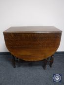 An oak gateleg table