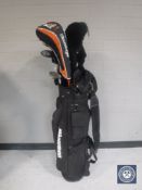 A Howson golf bag containing assorted drivers and Howson irons