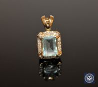 A 9ct gold aquamarine and diamond pendant, the emerald-cut aquamarine weighing 2.
