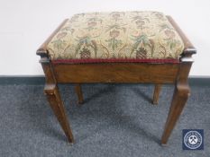 An early 20th century mahogany storage piano stool