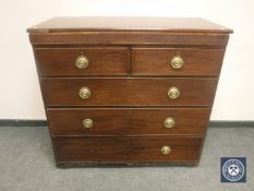 An early 19th century mahogany five drawer chest,