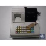 A cash register with key