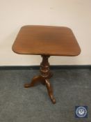 A Victorian pedestal tripod table, with square top,