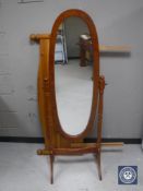 A pine cheval mirror together with a headboard