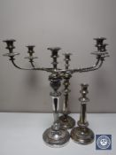A pair of Sheffield plated candelabrum and single candlestick (3)