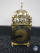 A brass Smiths lantern clock
