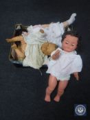 A box containing early 20th century and later dolls