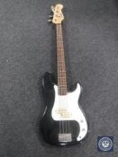 An Encore bass guitar