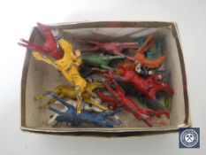 A box containing hand-painted metal Chad Valley figures of horses and jockeys