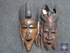 Two wooden tribal wall masks