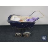 A mid 20th century coach built dolls pram with doll