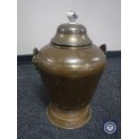 An antique copper lidded coal bucket