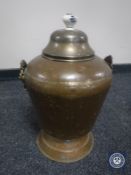An antique copper lidded coal bucket