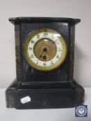 A Victorian slate brass mantel clock with brass and enamelled dial