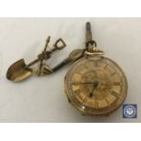 An 18ct gold fob watch with keys and a 9ct gold brooch