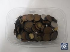 A tub containing pre-decimal British and foreign coins