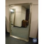 A traditional style silvered framed mirror,