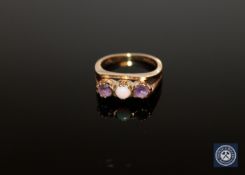 A 9ct gold three stone dress ring, size I.
