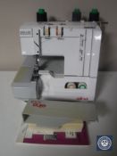 An Elna overlocking sewing machine (no foot pedal)