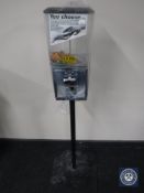 A gumball machine on stand