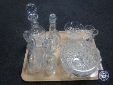 A tray containing four assorted lead crystal decanters together with three lead crystal vases and