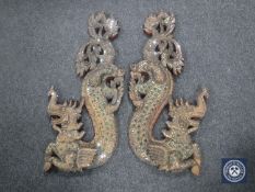 Two carved wooden 'jeweled' wall plaques in the form of dragons