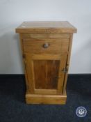 An antique pine pot cupboard