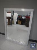 A contemporary silvered framed mirror